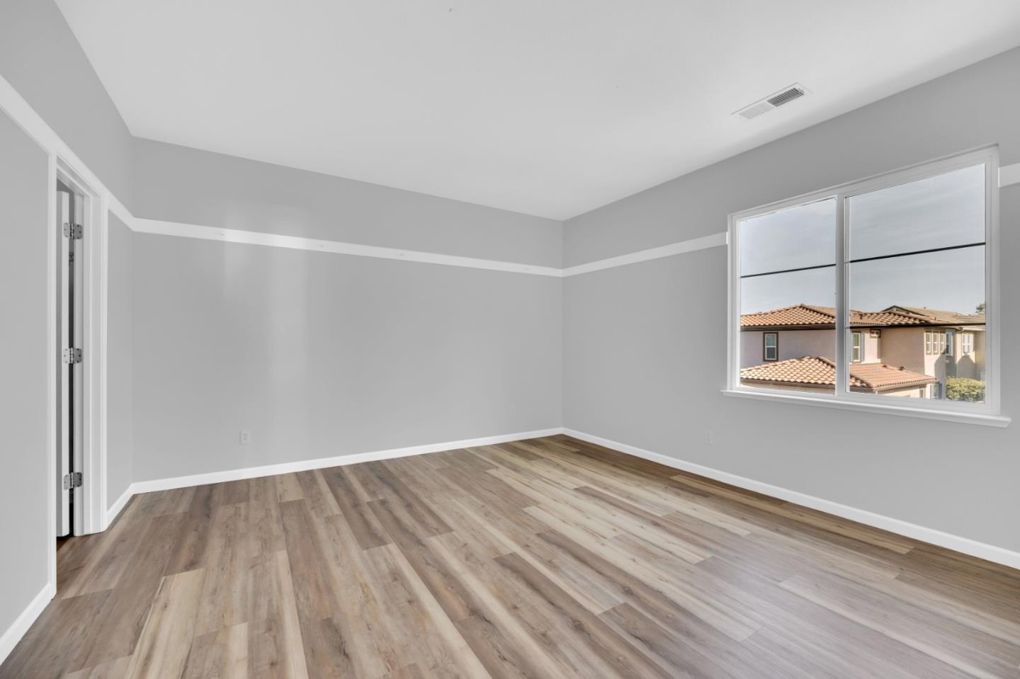 6367 Brando Loop Fair Oaks, CA 95628 - Photo 30 of 59 a view of a room with wooden floor and a window