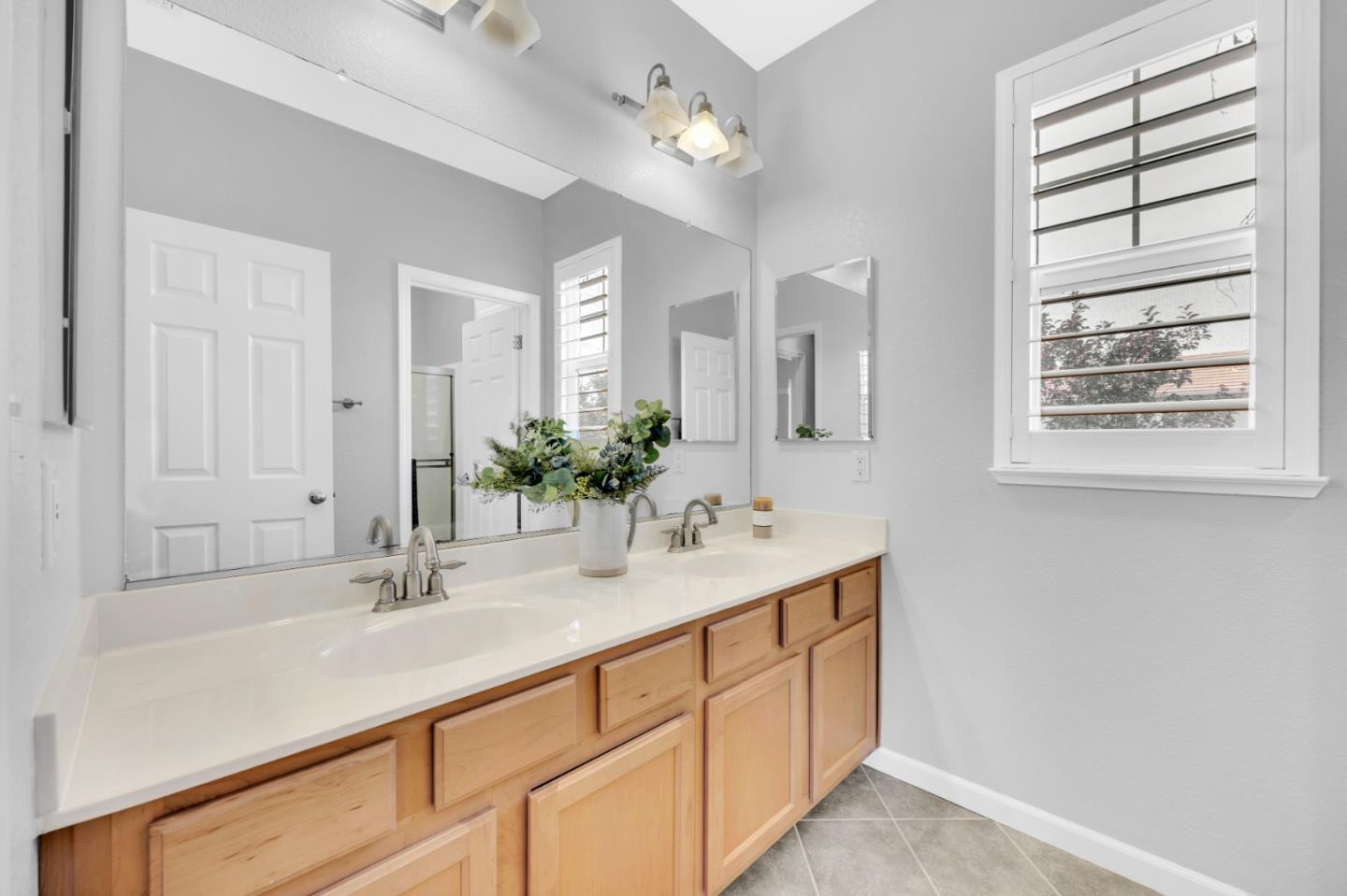 6367 Brando Loop Fair Oaks, CA 95628 - Photo 33 of 59 a bathroom with a sink double vanity and a mirror