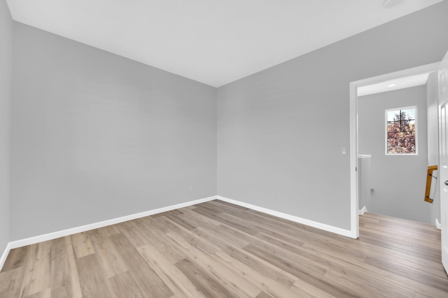 6367 Brando Loop Fair Oaks, CA 95628 - Photo 36 of 59 an empty room with wooden floor and windows