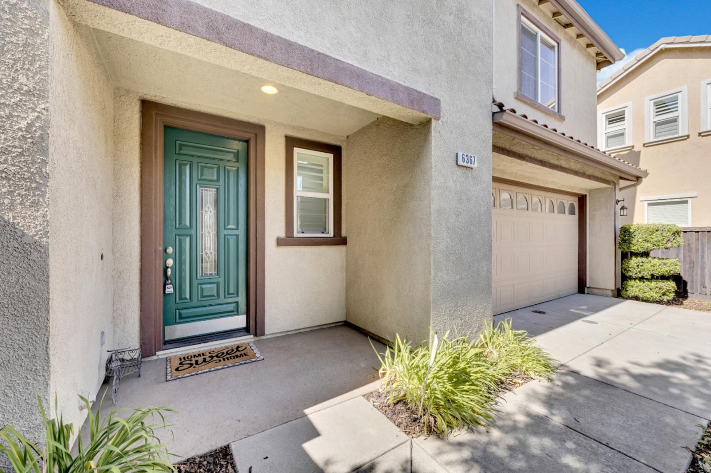 6367 Brando Loop Fair Oaks, CA 95628 - Photo 4 of 59 a view of an entryway with a flower plants