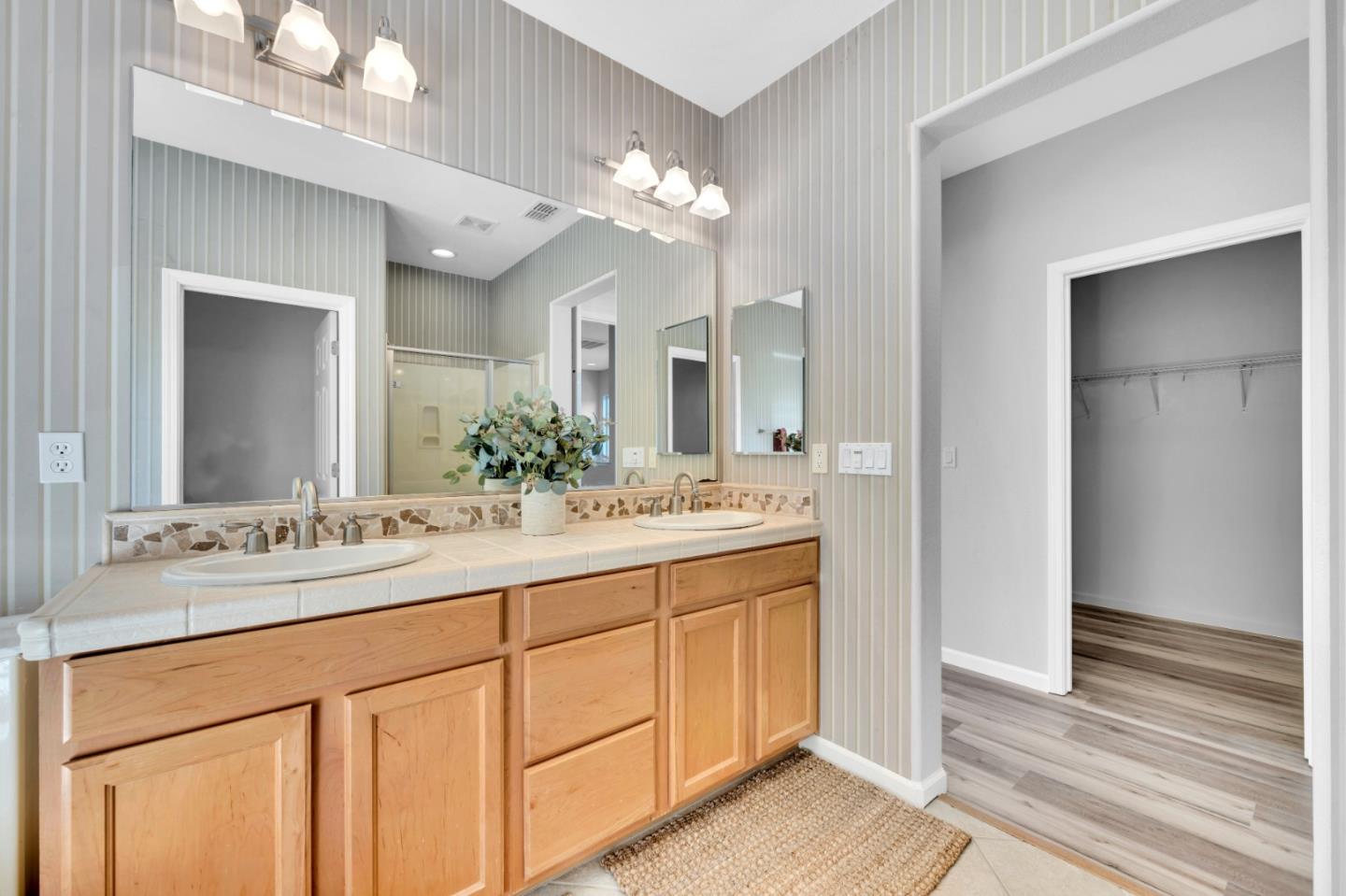 6367 Brando Loop Fair Oaks, CA 95628 - Photo 42 of 59 a bathroom with a sink vanity and a mirror