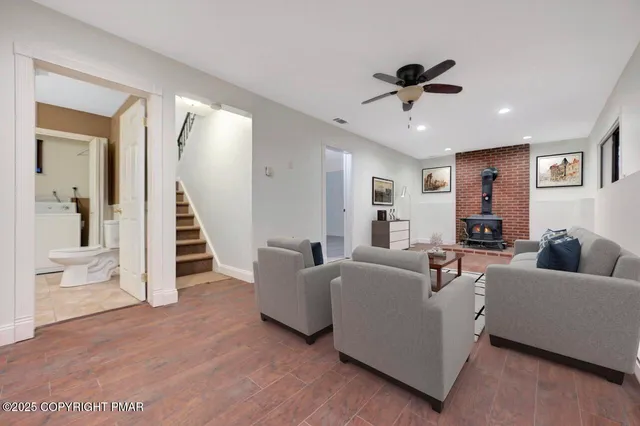 a kitchen with stainless steel appliances granite countertop a stove a refrigerator and a sink