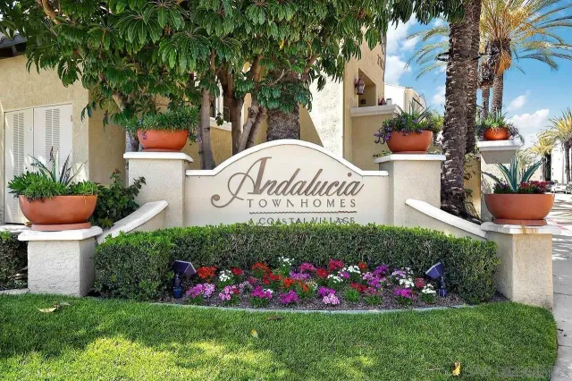 a sign that is in front of flowers