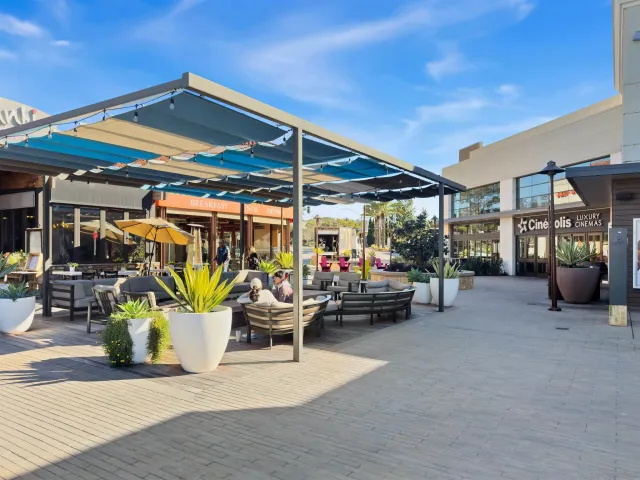 a view of a cafe with sitting area