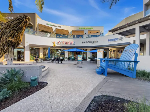 a living room with lots of furniture and a chandelier