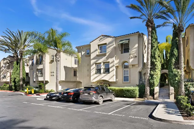 a view of multiple houses with a yard
