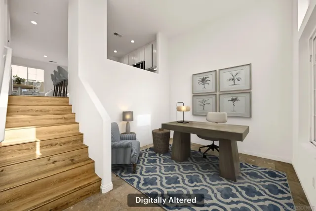 a view of a hallway with seating area