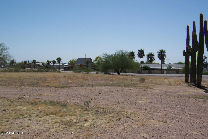 1483 South Tomahawk Road, Unit 27A Apache Junction, AZ 85119 - Photo 3 of 3 a view of a field with trees in background