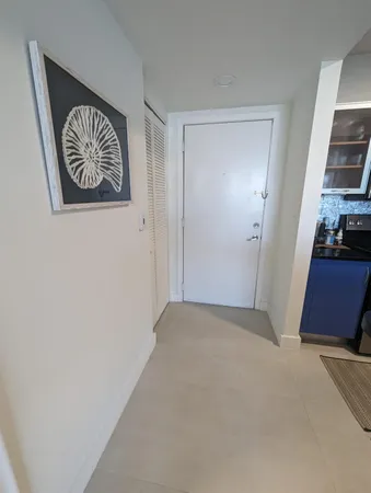 a view of a hallway with closet