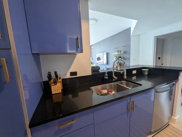a kitchen with a sink and cabinets