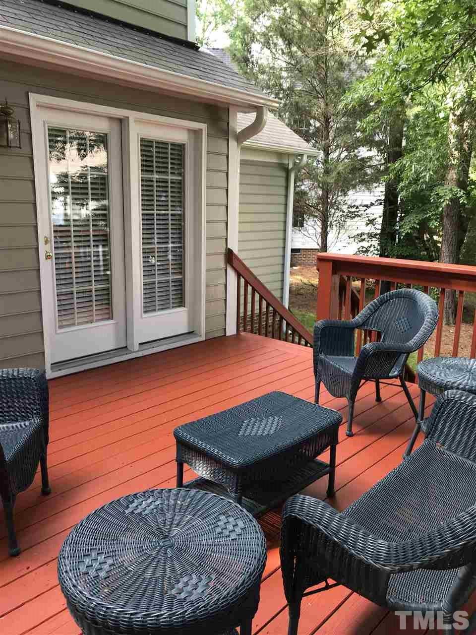 3609 Rubra Circle Raleigh, NC 27616 - Photo 15 of 15 Large shaded deck backing to hardwood trees. Door leads into kitchen/breakfast area and stairs lead to backyard with storage for garden tools, etc. under the deck.