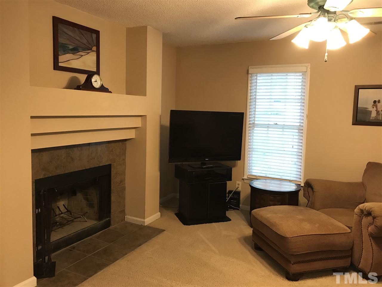 3609 Rubra Circle Raleigh, NC 27616 - Photo 3 of 15 Enjoy your wood burning fireplace in the comfortable living room