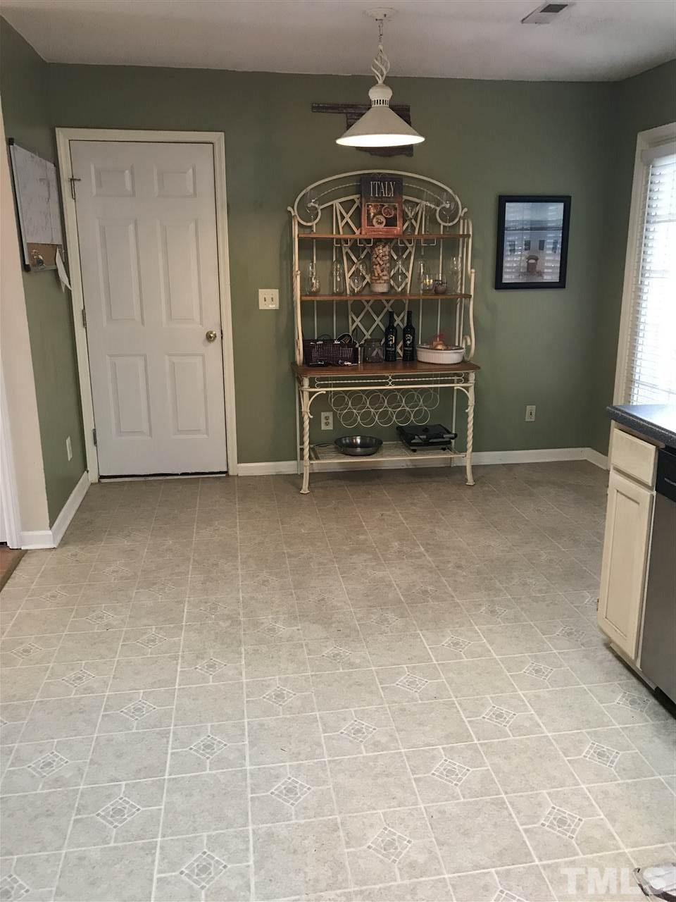 3609 Rubra Circle Raleigh, NC 27616 - Photo 6 of 15 Large space for breakfast area or.... in kitchen with glass door overlooking and leading to large, shaded deck.