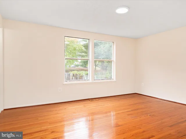 an empty room with a empty space and a window