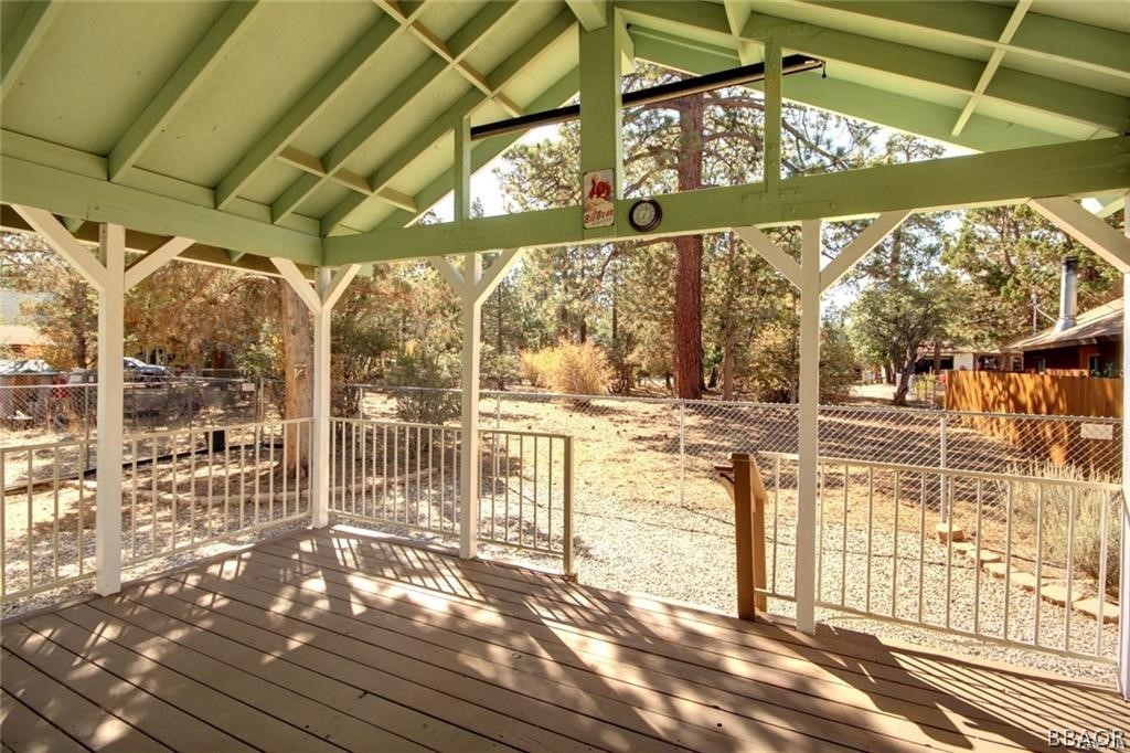 650 Riverside Avenue Sugarloaf, CA 92386 - Photo 14 of 15 a view of a porch with a table and chairs