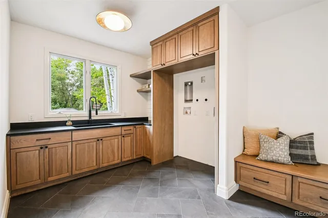 a large bathroom with a double vanity sink and a window