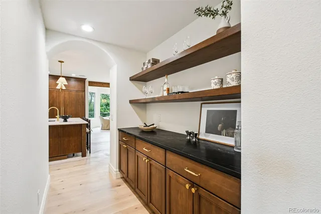 a kitchen with a sink and cabinets