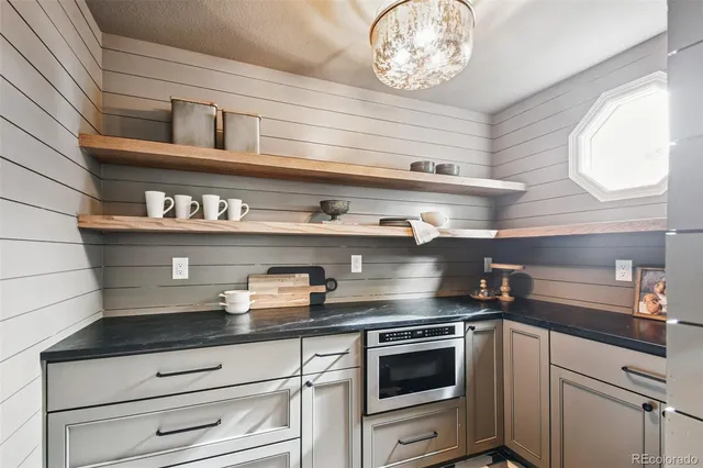 a kitchen with a stove and cabinets