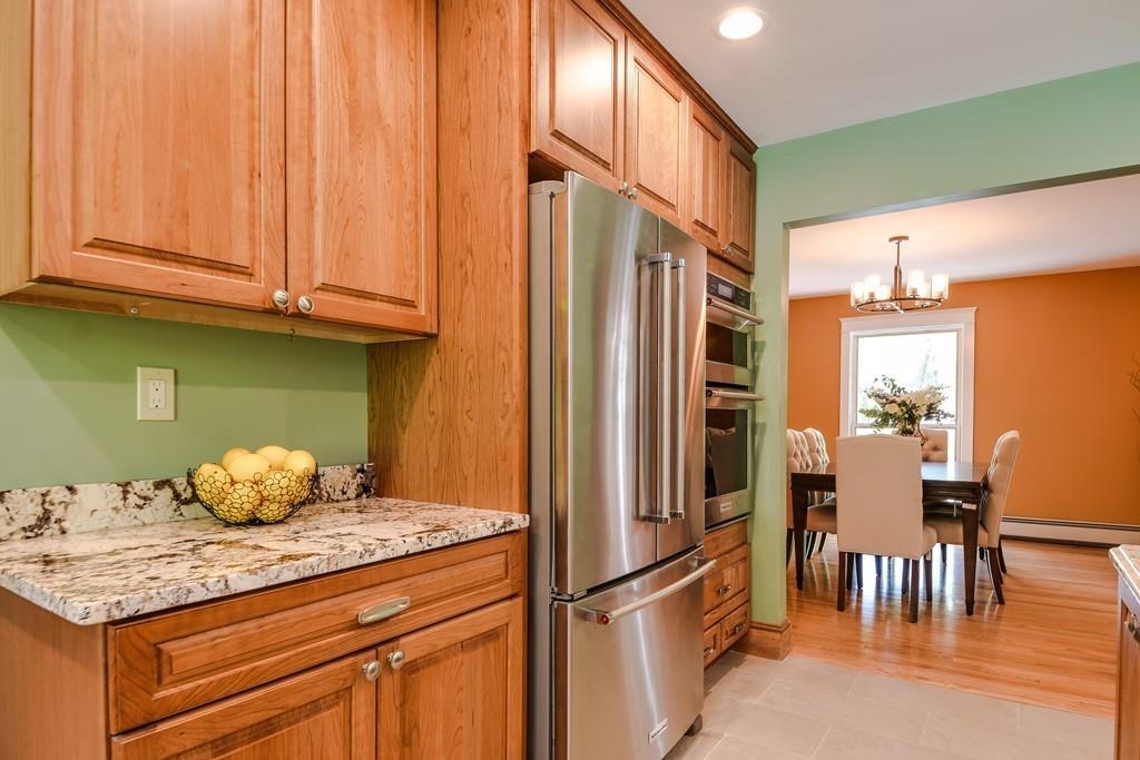 10 Lantern Road Framingham, MA 01702 - Photo 17 of 32 a kitchen with stainless steel appliances granite countertop a refrigerator and microwave