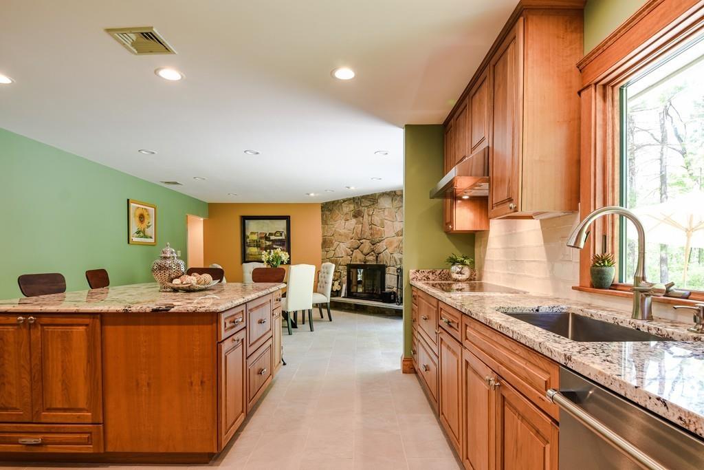 10 Lantern Road Framingham, MA 01702 - Photo 18 of 32 a kitchen with stainless steel appliances granite countertop a sink stove and cabinets