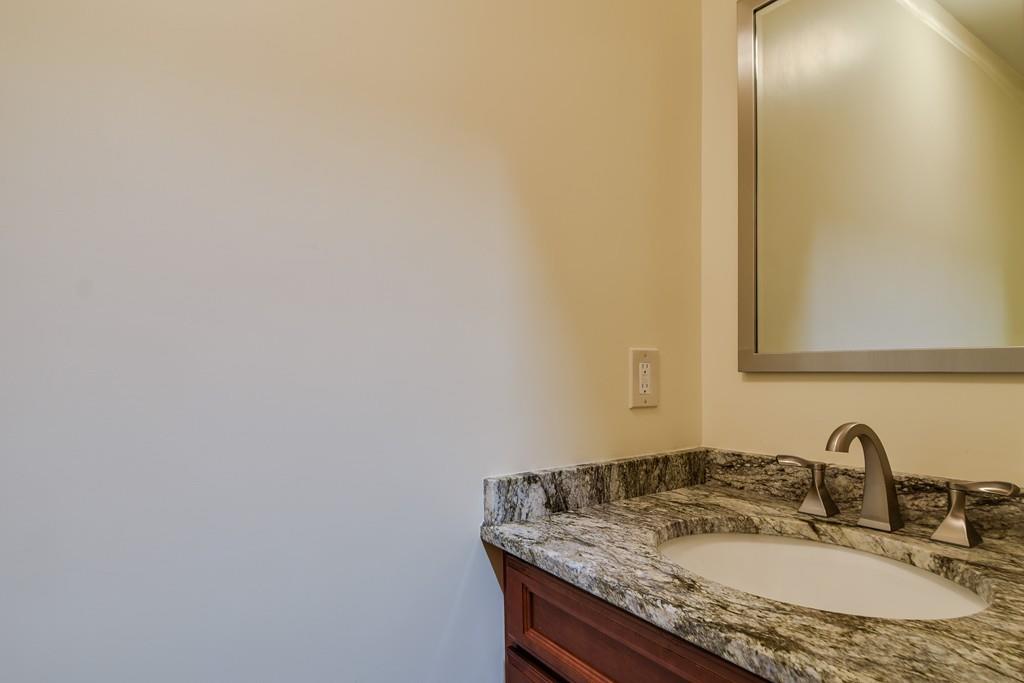 10 Lantern Road Framingham, MA 01702 - Photo 20 of 32 a bathroom with a granite countertop sink and a mirror
