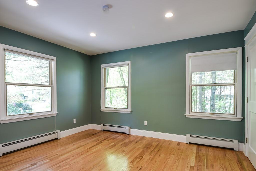 10 Lantern Road Framingham, MA 01702 - Photo 26 of 32 a view of an empty room with wooden floor and a window