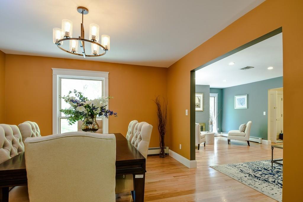 10 Lantern Road Framingham, MA 01702 - Photo 8 of 32 a view of a dining room with furniture wooden floor and chandelier