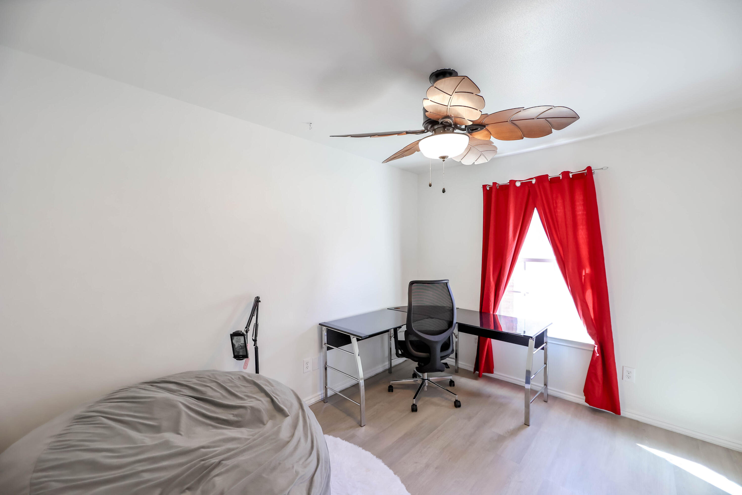 6718 92nd Street Lubbock, TX 79424 - Photo 16 of 31 a bedroom with a bed and a window