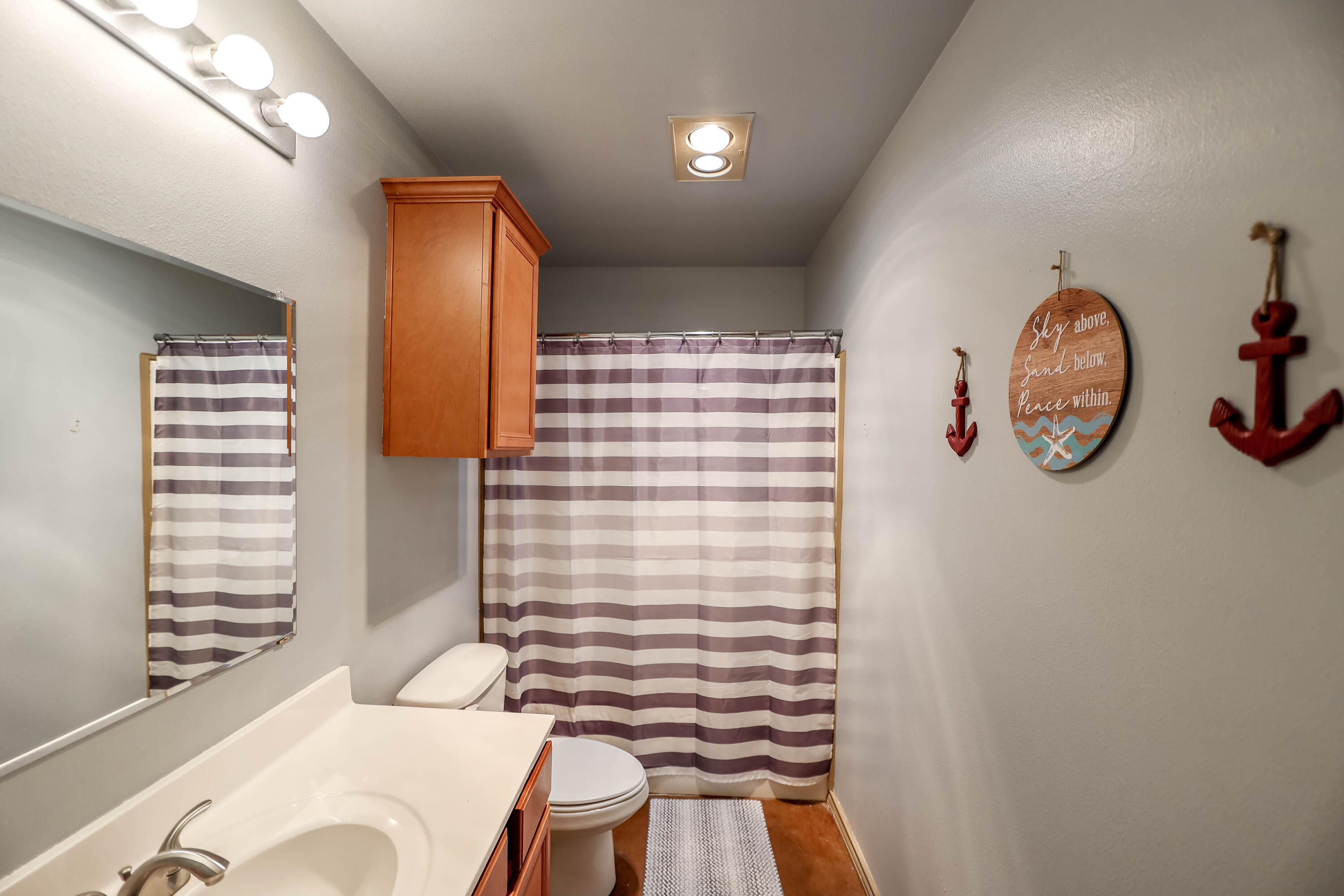 6718 92nd Street Lubbock, TX 79424 - Photo 18 of 31 a bathroom with a sink and a mirror