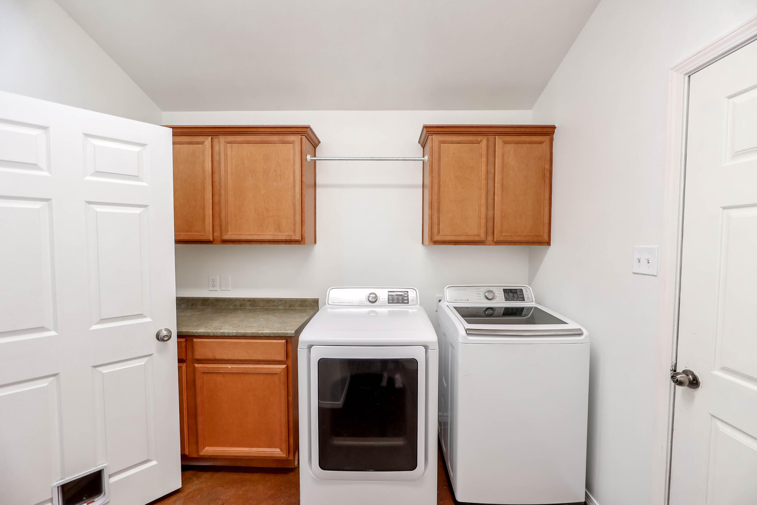 6718 92nd Street Lubbock, TX 79424 - Photo 23 of 31 a kitchen with stainless steel appliances a stove a microwave and a refrigerator