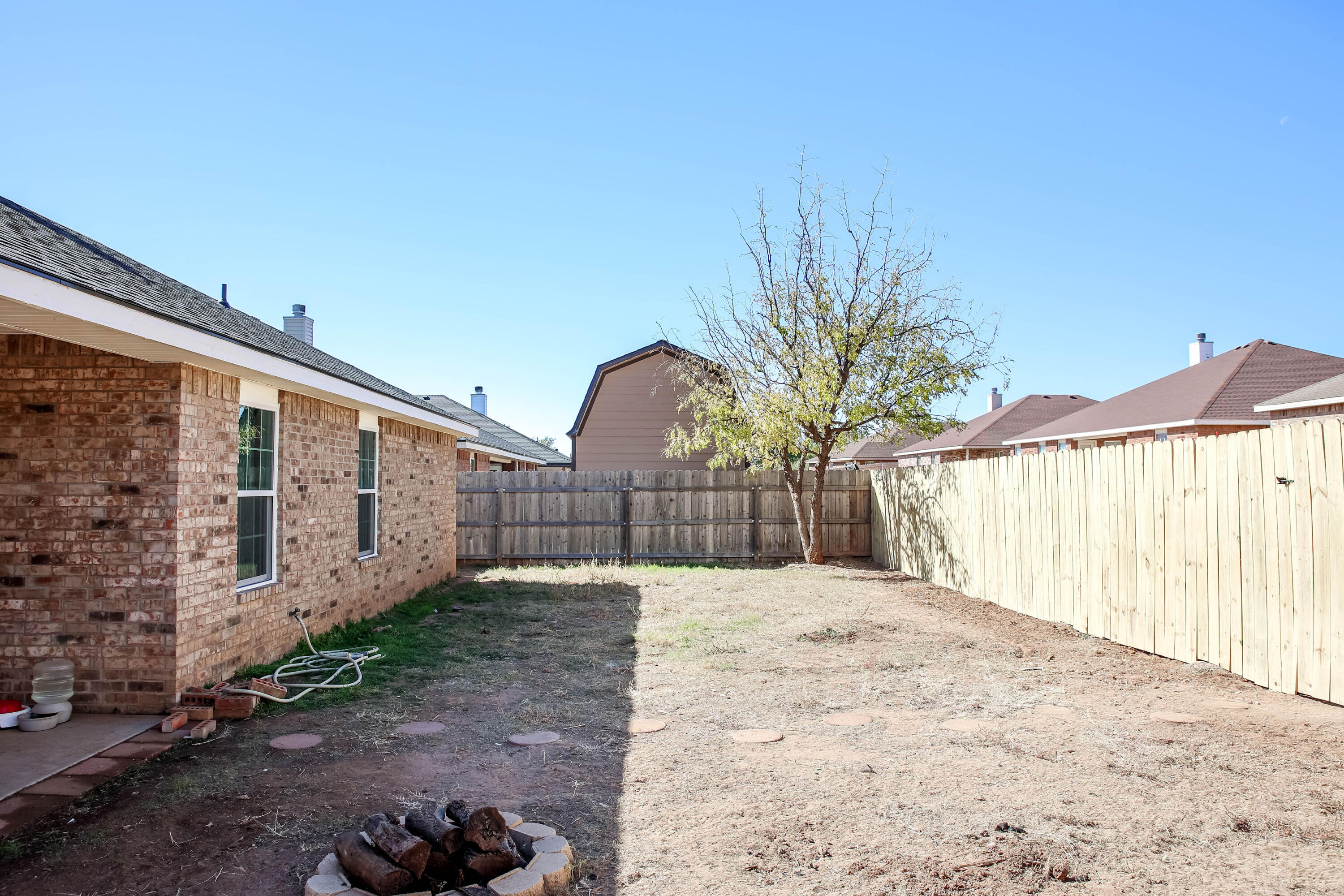 6718 92nd Street Lubbock, TX 79424 - Photo 27 of 31 a view of a backyard of the house