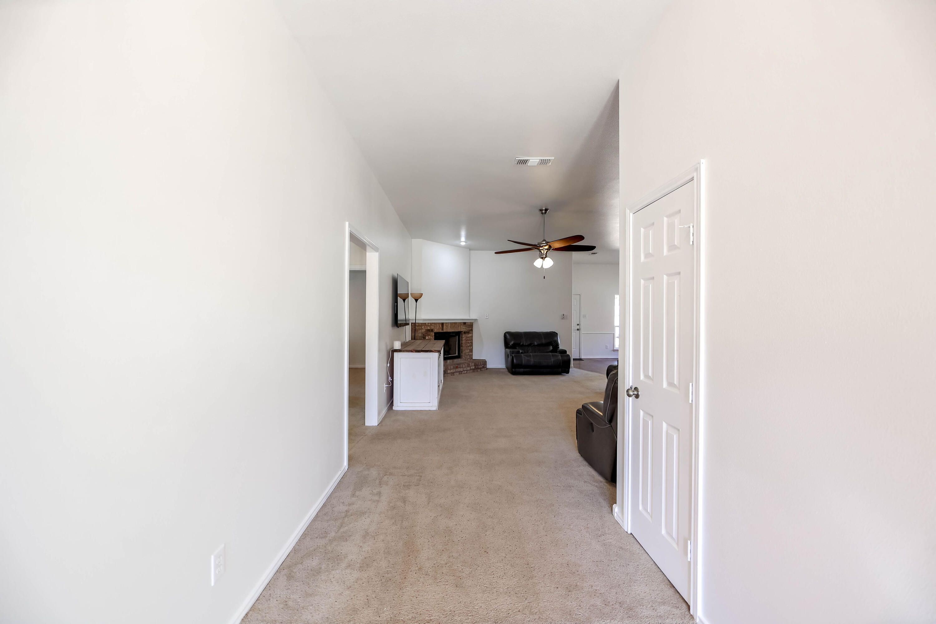 6718 92nd Street Lubbock, TX 79424 - Photo 3 of 31 a view of a living room with a hallway