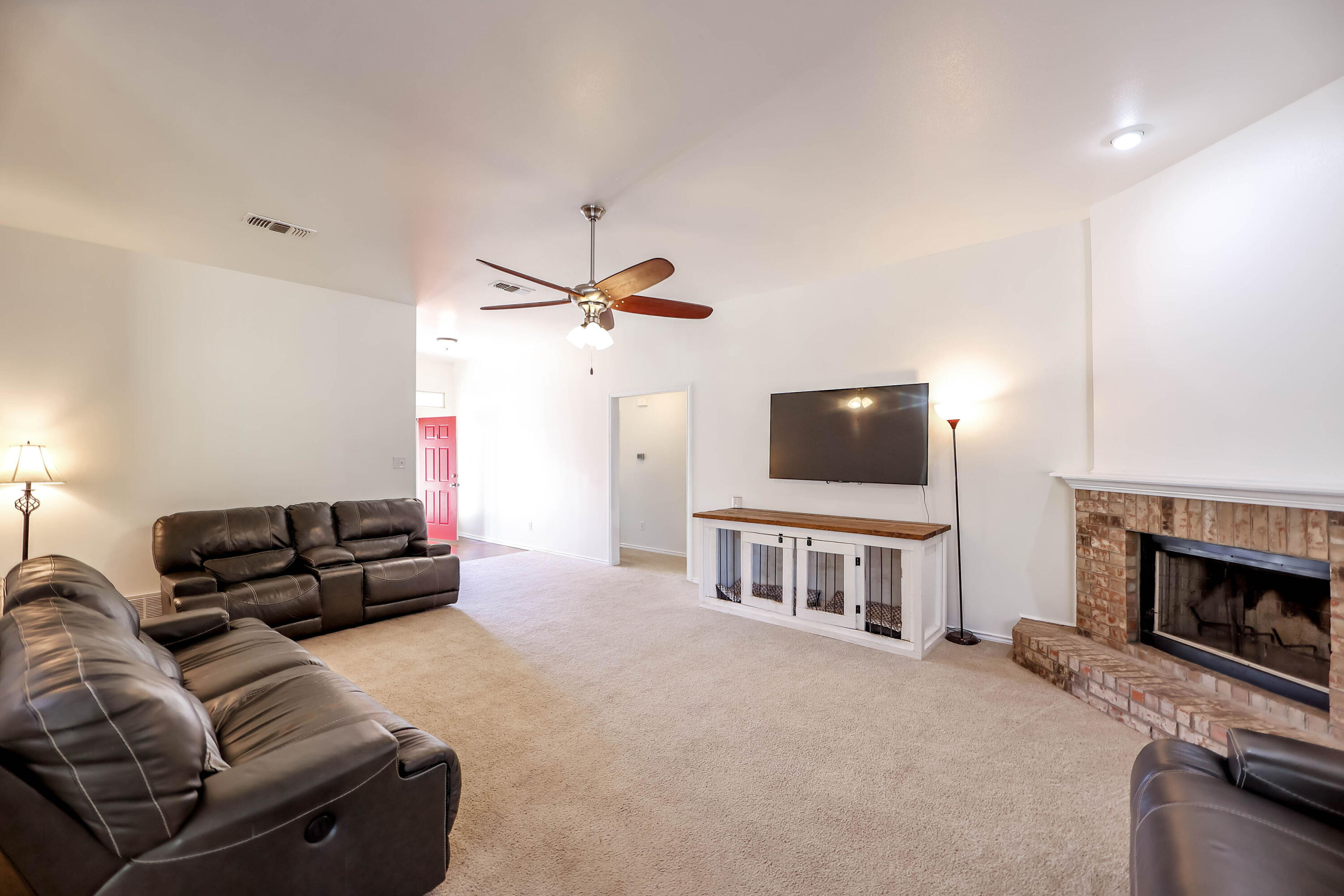 6718 92nd Street Lubbock, TX 79424 - Photo 7 of 31 a living room with furniture and a flat screen tv
