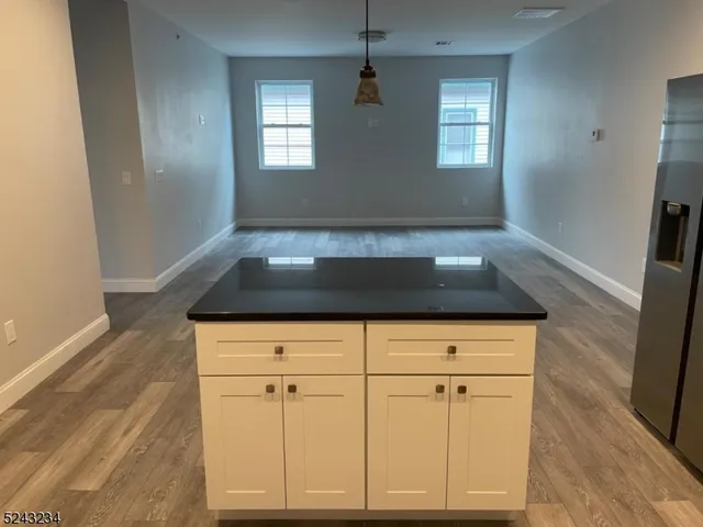 a stove top oven sitting inside of a kitchen
