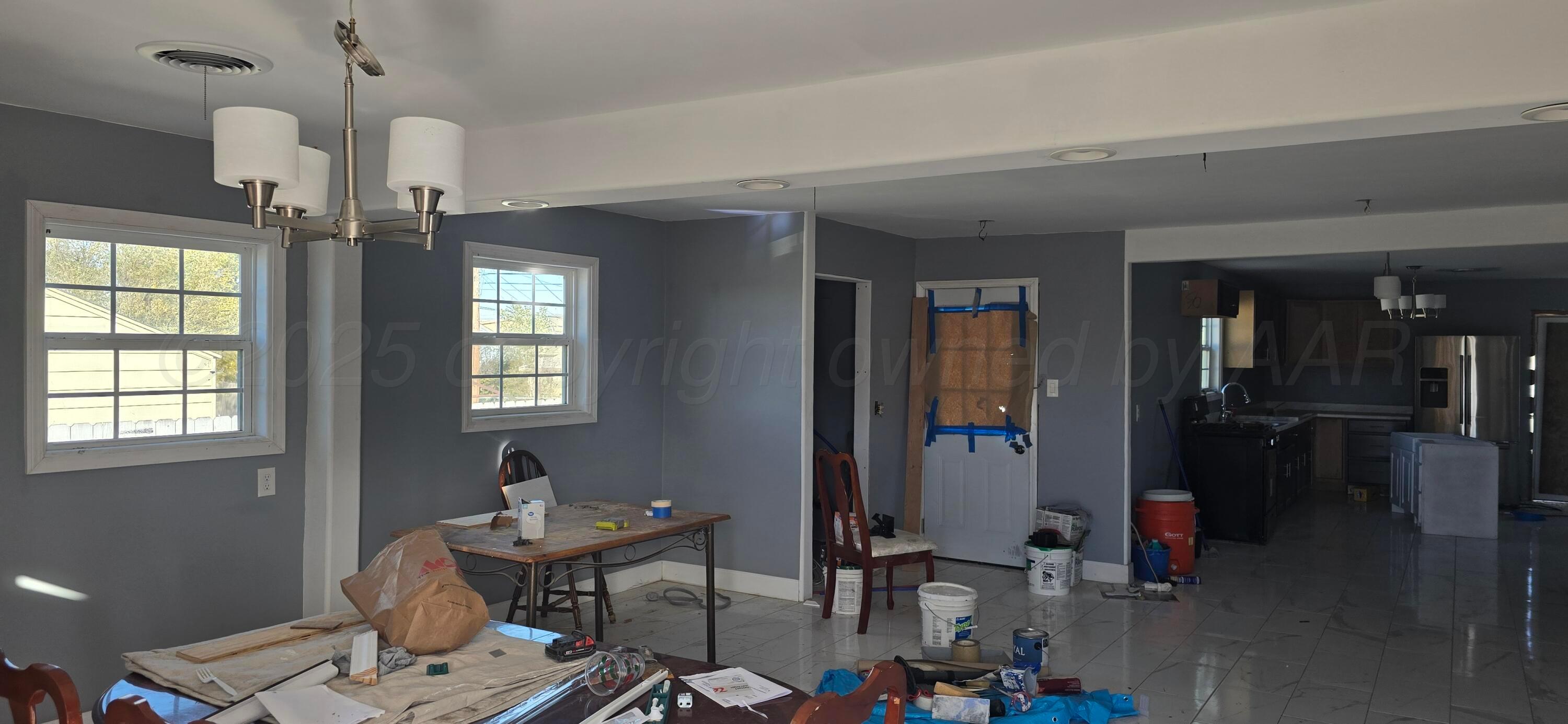 904 Elmore Street Borger, TX 79007 - Photo 4 of 20 a view of a livingroom with furniture window and wooden floor