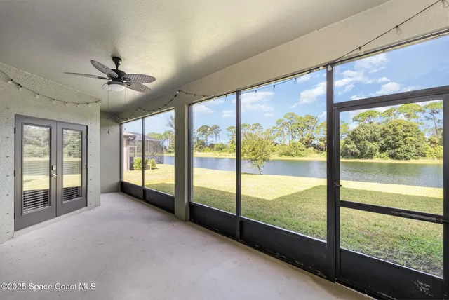 a view of an empty room with a large window