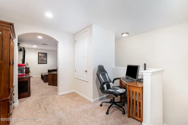 a view of a workspace with furniture