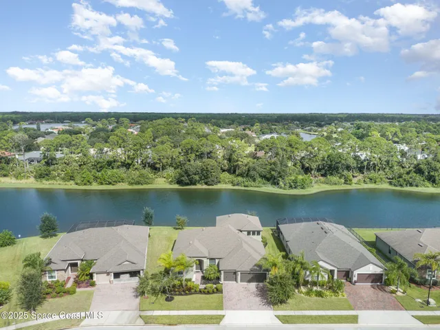 an aerial view of a city with lake view