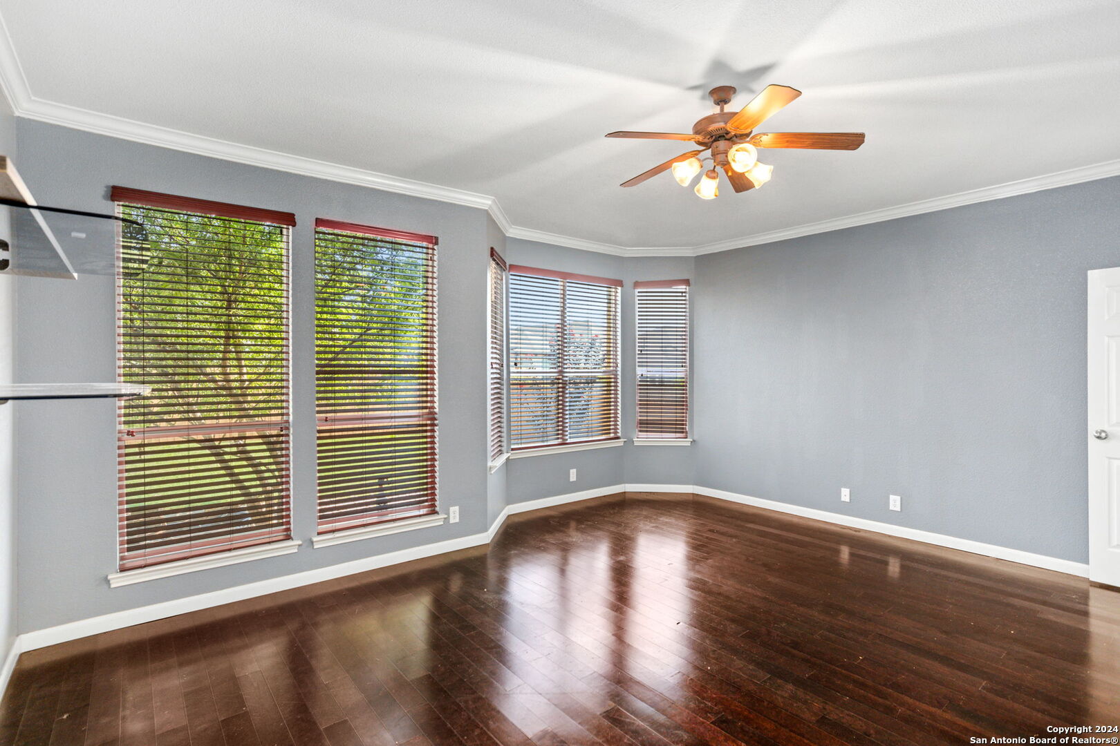 3415 Highline Trail San Antonio, TX 78261 - Photo 11 of 24 a view of an empty room with wooden floor and a window