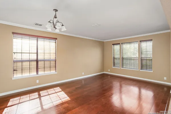 a view of an empty room with a window