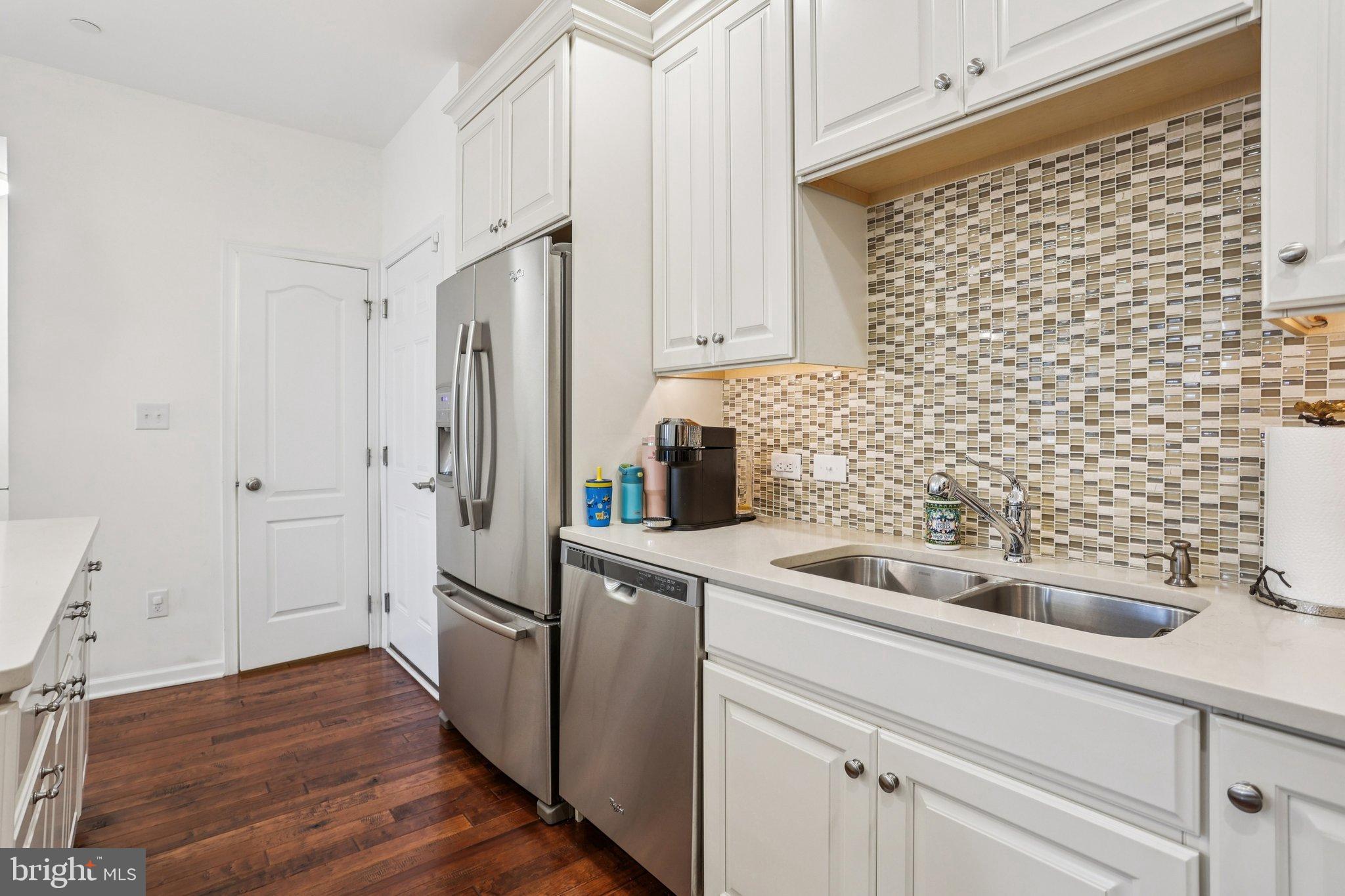 106 A Jay Alley Springfield, PA 19064 - Photo 11 of 44 a kitchen with a sink and refrigerator