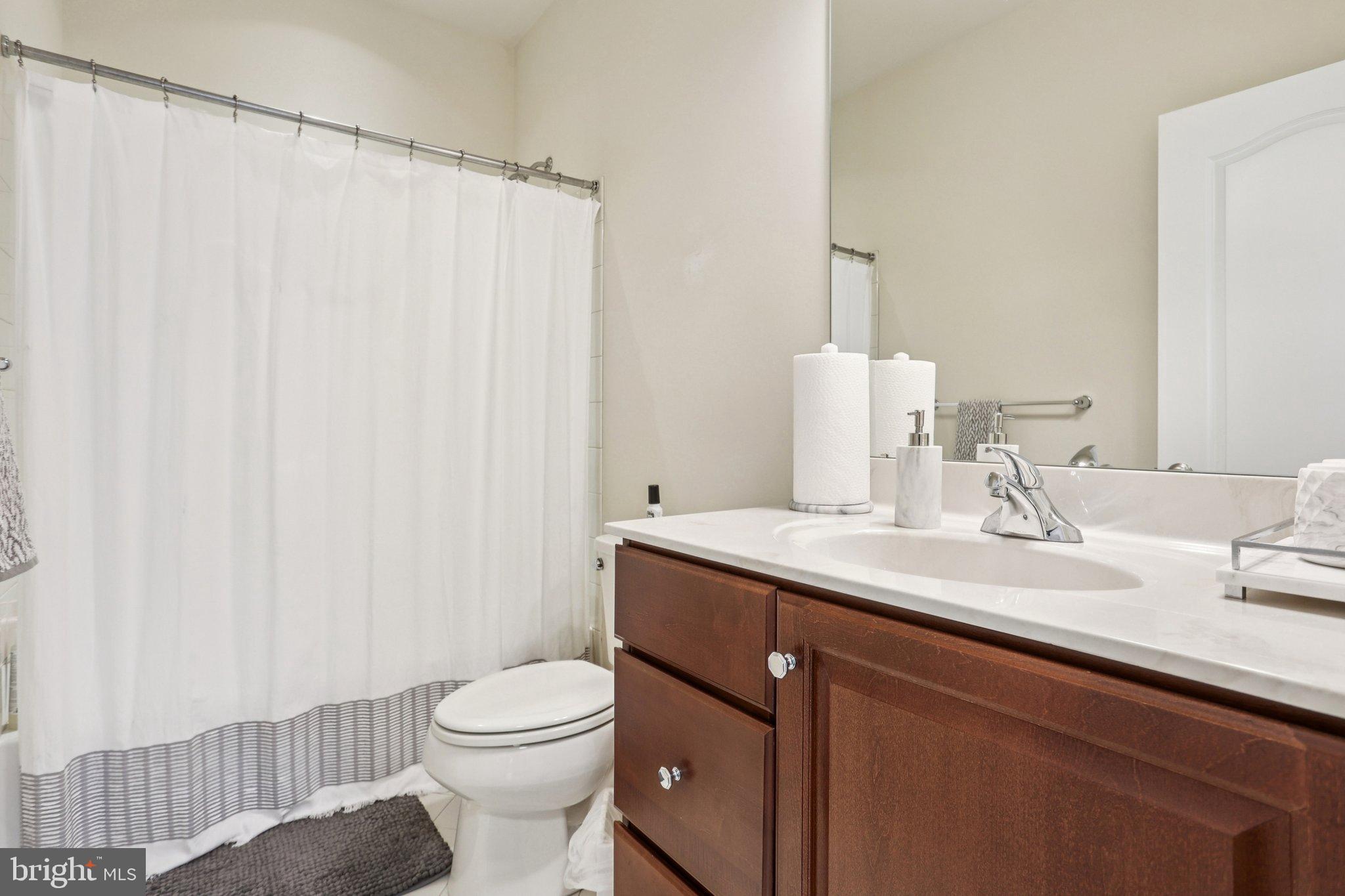 106 A Jay Alley Springfield, PA 19064 - Photo 22 of 44 a bathroom with a sink a toilet and shower