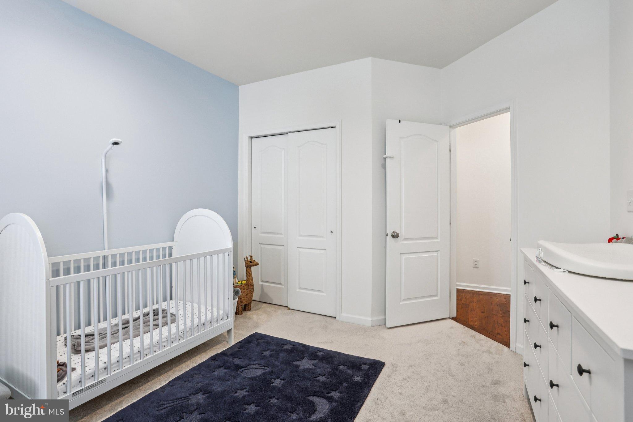 106 A Jay Alley Springfield, PA 19064 - Photo 29 of 44 a view of a bedroom with wooden floor & rug floor