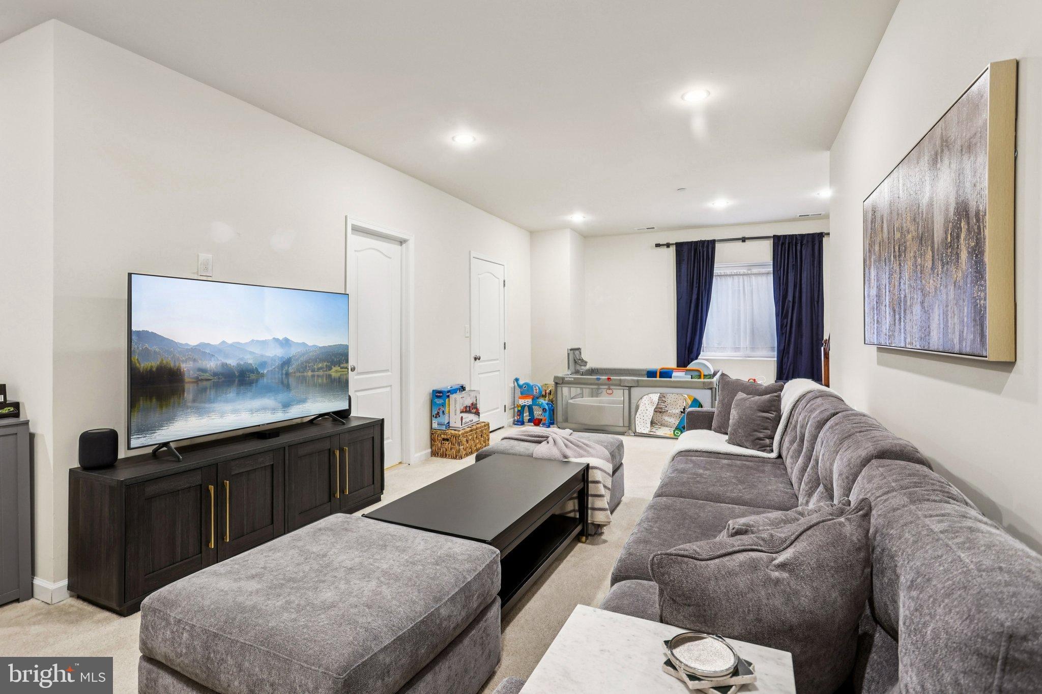 106 A Jay Alley Springfield, PA 19064 - Photo 33 of 44 a living room with furniture and a flat screen tv