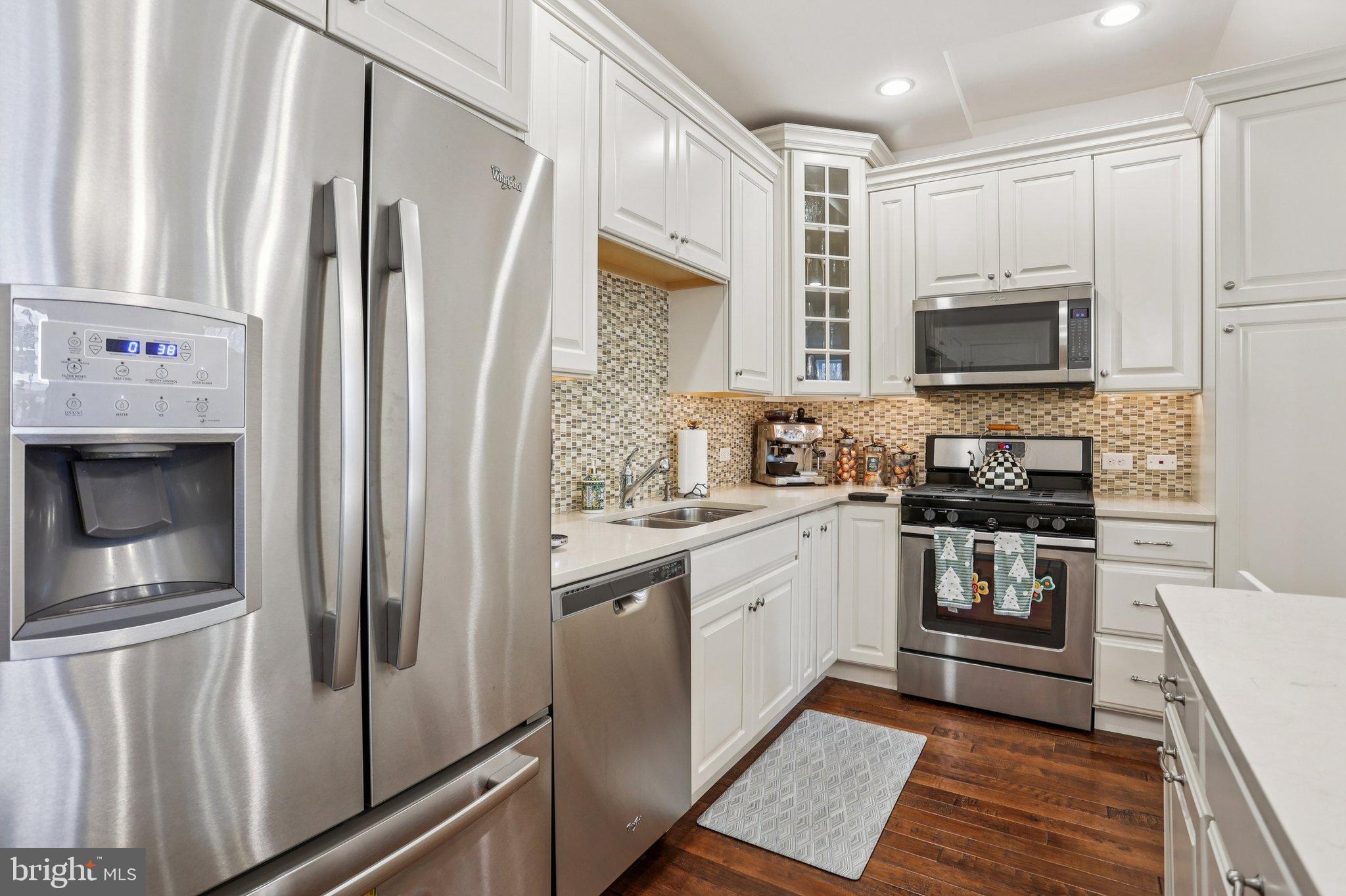 106 A Jay Alley Springfield, PA 19064 - Photo 10 of 44 a kitchen with stainless steel appliances a refrigerator sink and microwave