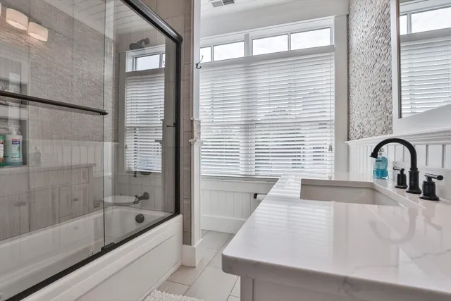 a bathroom with a bathtub and a sink