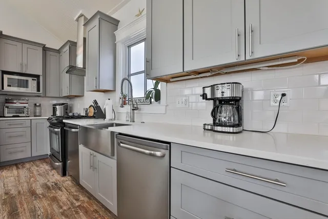 a kitchen with a sink and cabinets