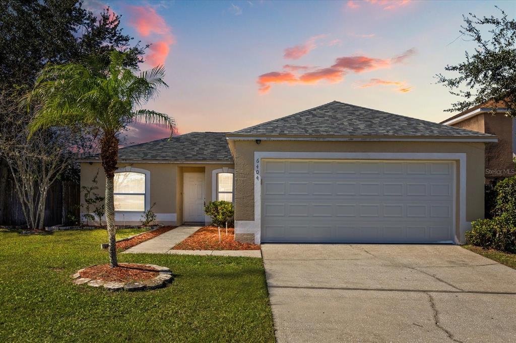 6404 Pomeroy Circle Orlando, FL 32810 - Photo 1 of 1 a front view of a house with a yard