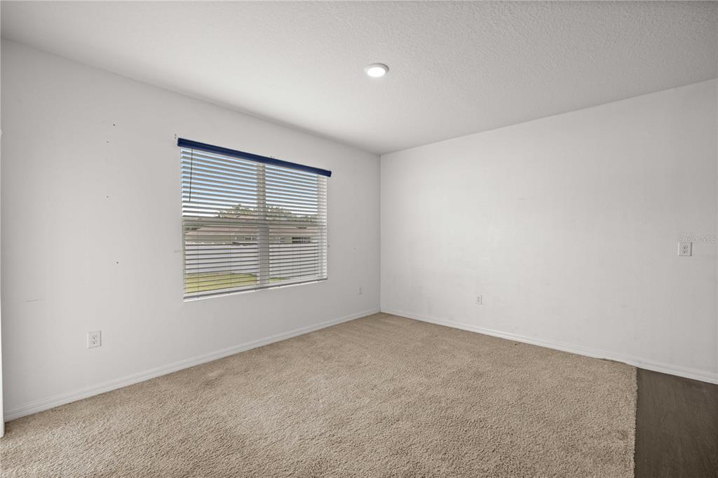 3902 Southeast 99th Street Belleview, FL 34420 - Photo 11 of 28 an empty room with a window