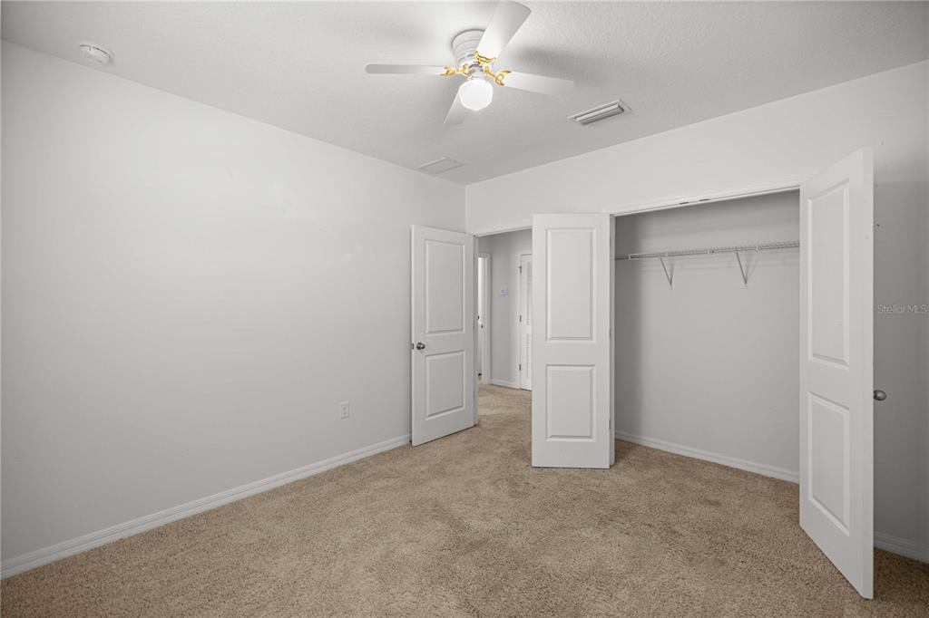 3902 Southeast 99th Street Belleview, FL 34420 - Photo 25 of 28 wooden floor in an empty room